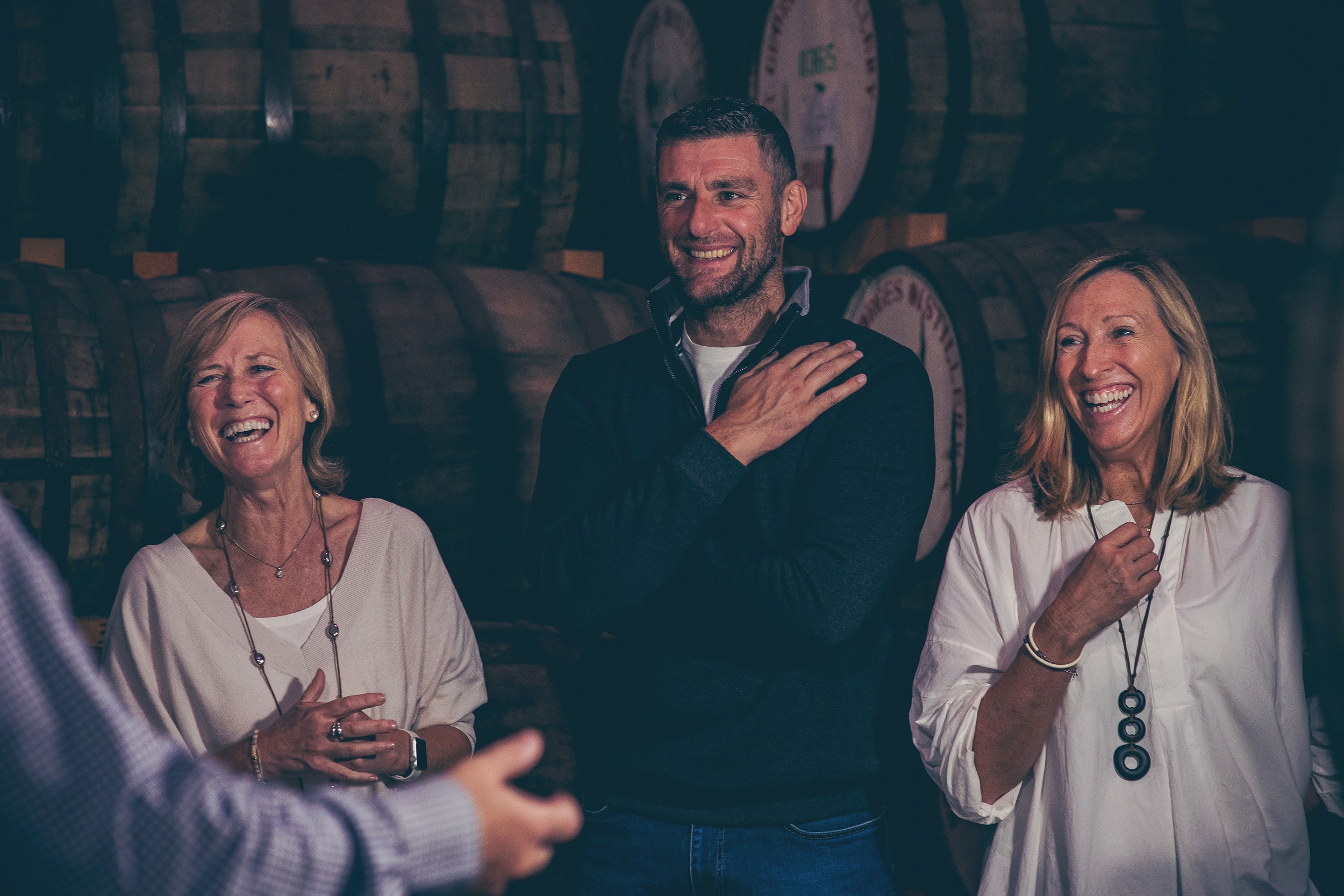 A group enjoying the barrel warehouse on a tour