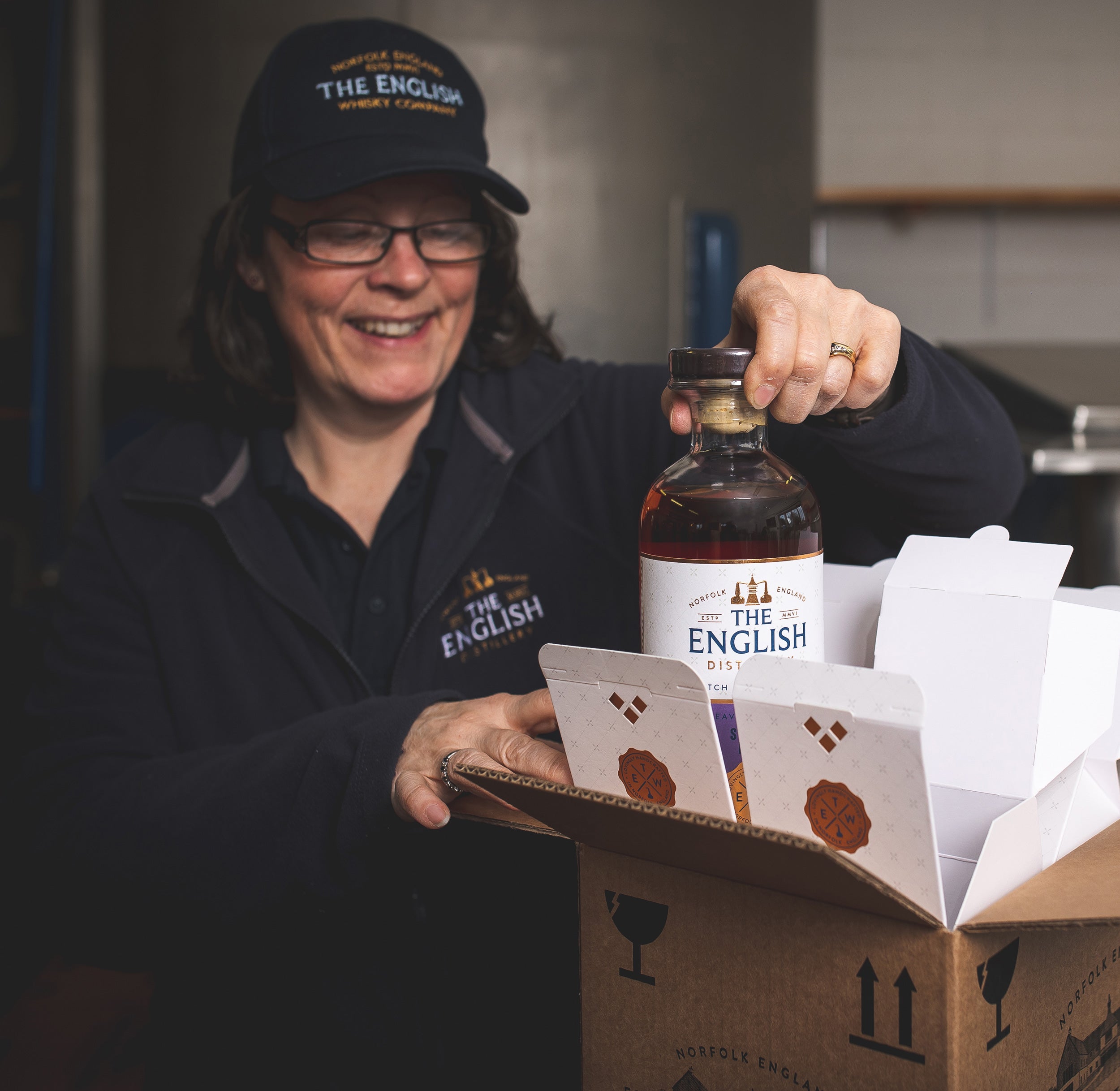 Helen from our distillery team packing a small batch release