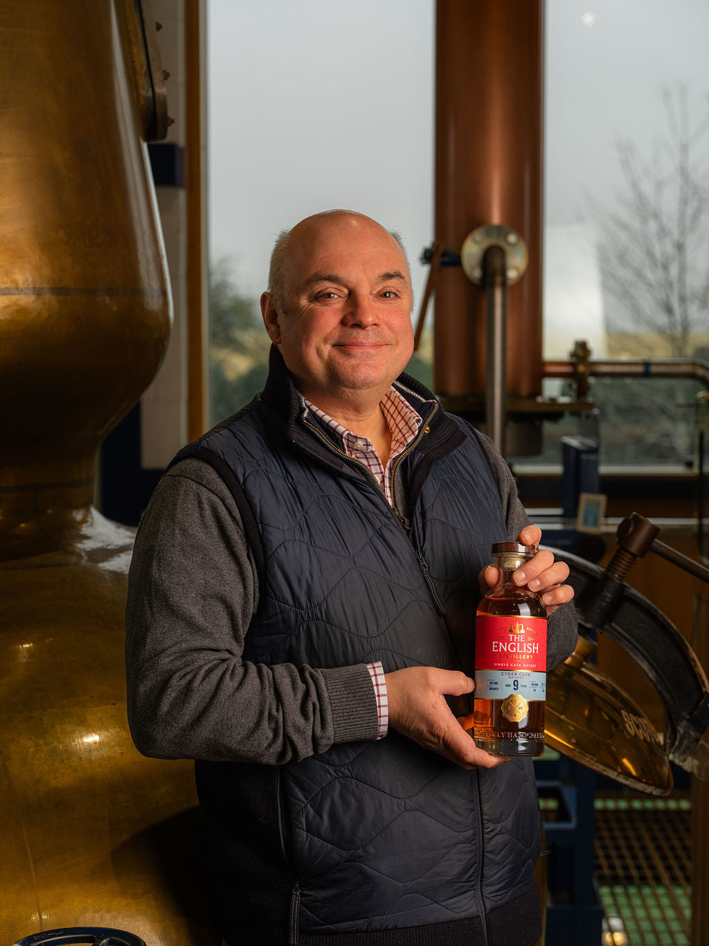 Andrew Nelstrop with a bottle of single cask whisky from The English Distillery